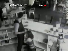 Security cam footage of a sexy brunnette giving head in a store