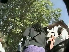 A Brunette and a black hair woman get filmed by a spy cam upskirt