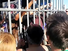 Blonde in the cage is performing erotic strip show in public