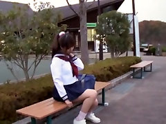 Sexy schoolgirl tandas awek sitting on the park bench view