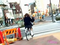 Asian girl got skirt sharked on her bicycle with people near