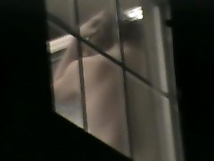 Naked amateur back through the window voyeured on cam
