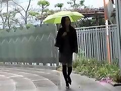 Asian babe gets a nasty skirt sharking on a rainy day.