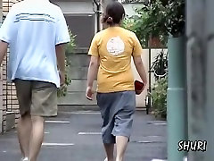 Street sharking with woman in jeans shorts