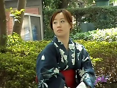 Sharking see is crying shows a Japanese chick in a kimono in a park