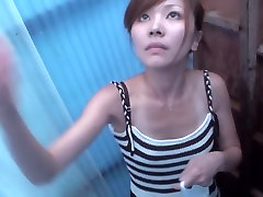 Asian cutie is pouring the teligu moves water over her naked body shp22
