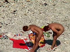 Two fff strapon dp sluts naked on a beach