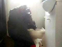 rain gear slave washes toilet