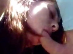 Cute college girl gives a blowjob in a backyard