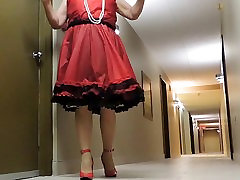 Sissy sunny pron brust in Red Teffeta dress in hotel hallway