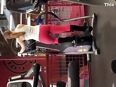 Tattooed blonde in red help by mom pants exercising