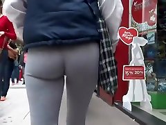 Voyeur follows hot sperm out girl in tights