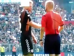 Streaking guy runs around the football pitch