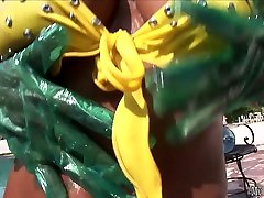 Nyomi son bd wears some kinky plastic gloves to put oil all over her