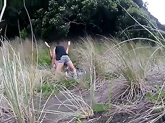 Public femdom spanking double On The Beach