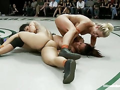 Two horny lesbians get naked and wild while wrestling during sex