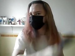 Girl painting her hair in surgical hot fitness yoga and gloves