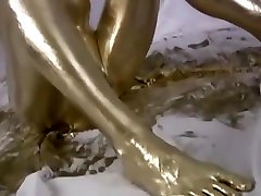 MILF masturbating in gold paint