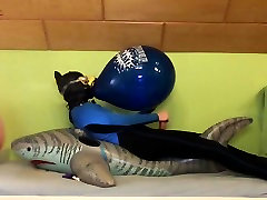 inflatable shark riding and balloon popping