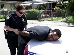 A black guy is questioned by the police.