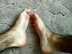 very hairy legs -- top view bare feet -- a guy on youtube