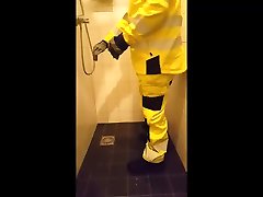 shower in yellow reflective gear after peeing on it