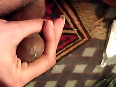 Thick brown cock unloads a big white pulsating ejaculation