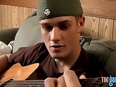 Foot fetishist young gay playing guitar and cock solo