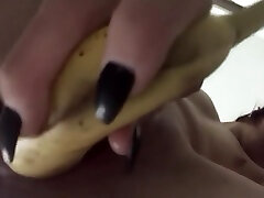 Teens tight pussy takes a big banana and dildo