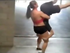 strong atletic girl lifts guy