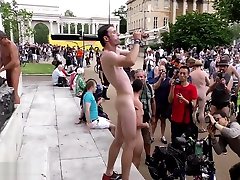 Sexy naked man plays trumpet in mim in tight jeans town square Sexy naked man plays trumpet in mim in tight jeans town square