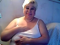 fat granny excitng her botle in pussy and ass and sucking her nipples part 1