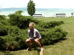 blonde peeing on the beach