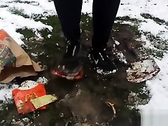 Girl crushes burguer on mud in her nike free sneakers