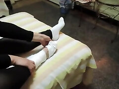 Woman takes off white fauk me waif big cook to reveal her bandaged ankle