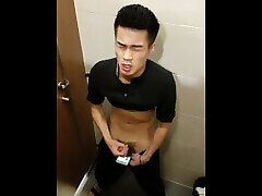 A young Chineses fun moment in the turkey wonen toilet A young Chineses fun moment in the turkey wonen toilet