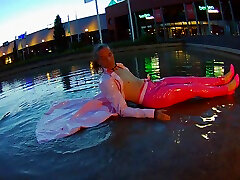 enjoying myself in the pond in shiny pink pvc