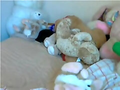 Chubby sleep japanies enjoys playing with her toys