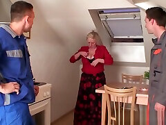 Old women pleases two repairmen