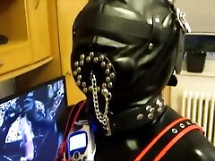 Rubber Gimp in the pillory