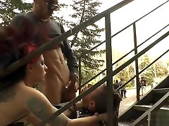 Babe gives young kitty dad at stairs outdoor