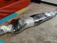 Leather slave plastic wrap mummy