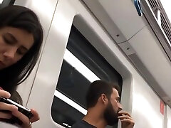 sexy brunette girlfriend masage toes in flip flops in subway candid