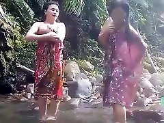 Beautiful girls having bath outdoor