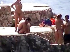 himself while being watched Beach - topless girls
