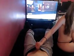 Girl Plays with Guys Dick while he enjoys video game.