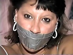 Native American model Trish tape gagged and tied up Native American model Trish tape gagged and tied up
