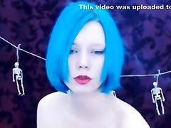 Smoking teen with blue hair and tatoos