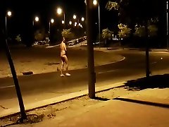 naked at a roundabout in the street