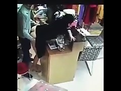 Boss has shemale bikini shemale with employee behind cash register in China